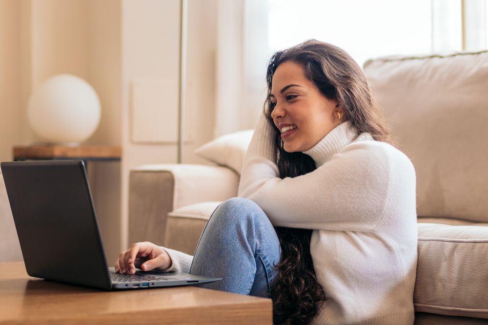 Home Productivity: Young Woman Working on Laptop