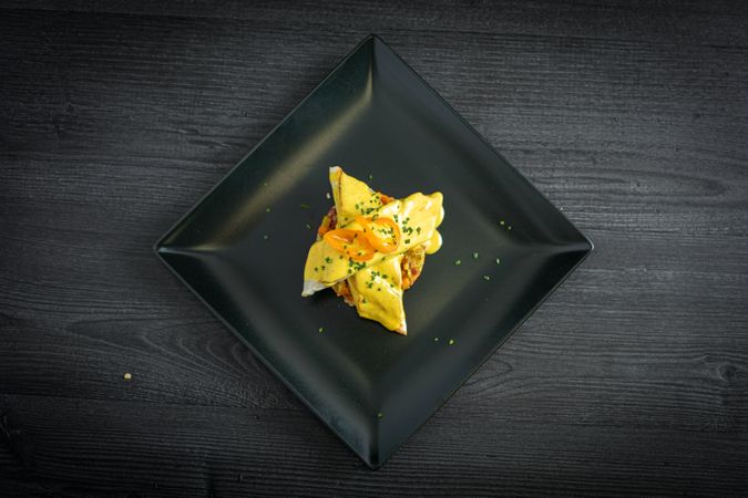 Corvina with yellow pepper sauce in plate