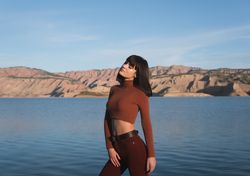 Sensual female standing near water