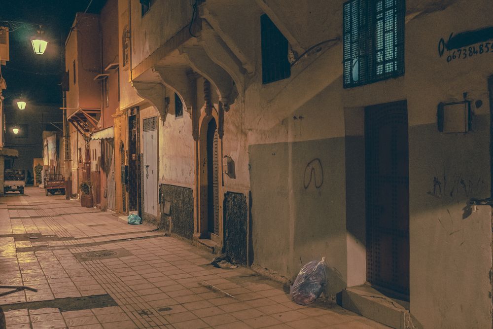 Old narrow street of town at night