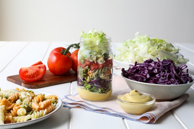 Pasta with vegetables and sauce in jar