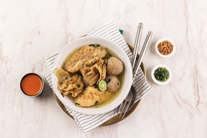 Top View Baso Cuanki Bandung, Meatball and Tofu Soup with Beef Broth.