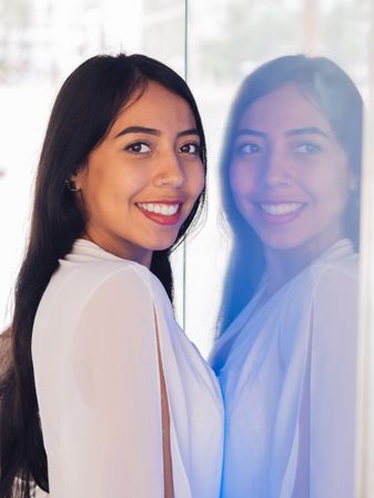Young woman in beautiful dress smiling