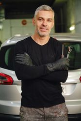 Confident mechanic in garage