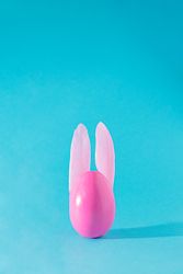Pink egg with feather bunny ears