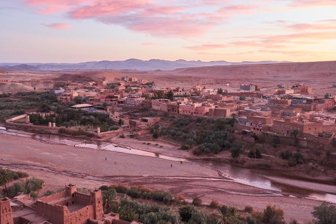 Ancient city near river in desert and wonderful sky