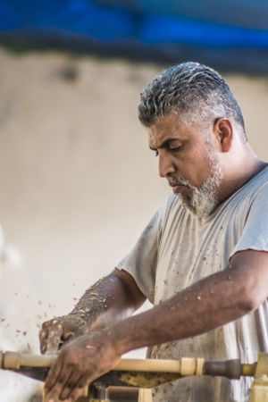 Man using woodworking machine at workplace