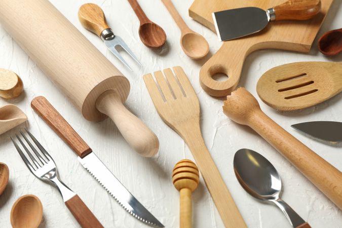Composition with different kitchen cutlery on plain background
