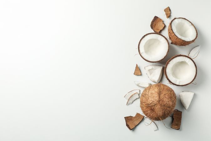 Coconut on plain background, top view and space for text