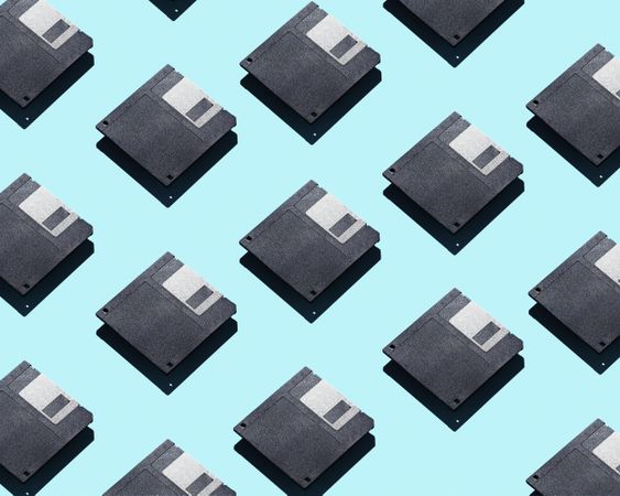 Floppy disks over light blue background
