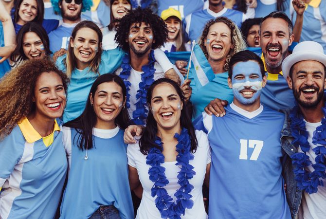 Group of spectators in stadium cheering their Argentina soccer team
