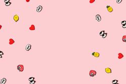 Pattern made of pop art symbols on pastel pink background