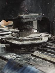 Metal pressing machine and tile mold in workshop