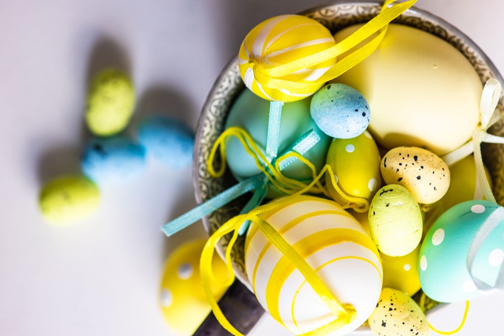 Top view of bowl of decorative pastel eggs