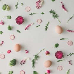 Colorful vegetable pattern made of broccoli, eggs, beetroot and radish