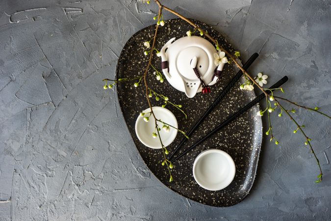 Asian style tea set with decorative branch
