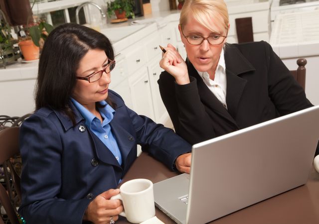 Businesswomen Collaborating on the Laptop