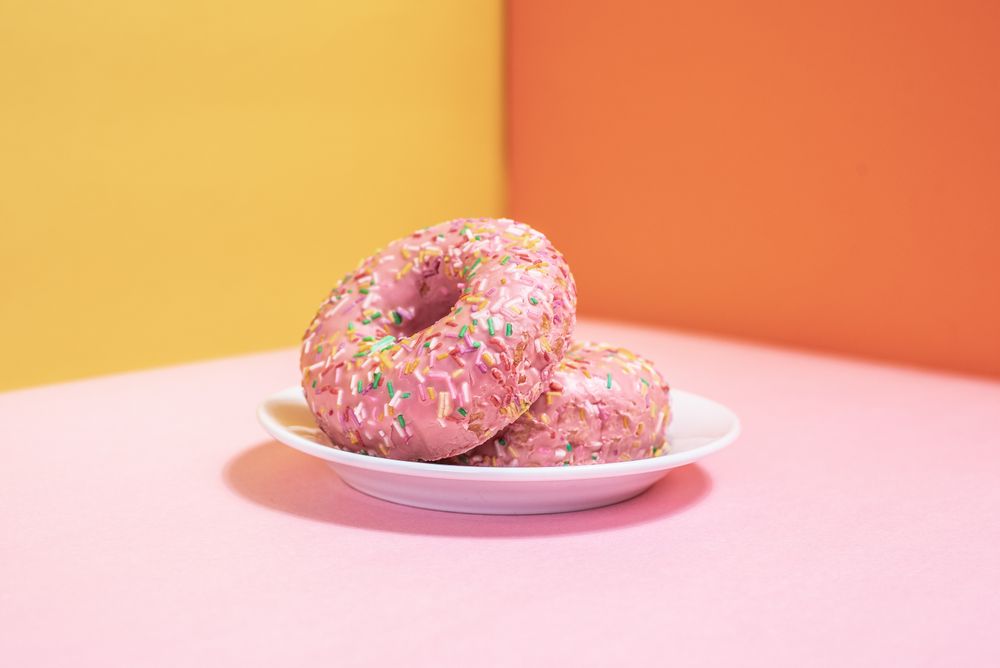 Pink doughnuts in a multicolor background