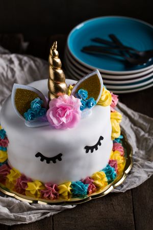 Cute unicorn cake with painted closed eyes