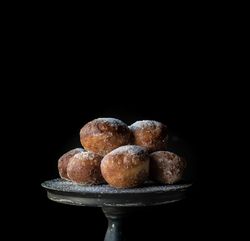 Baked cakes on stand on table