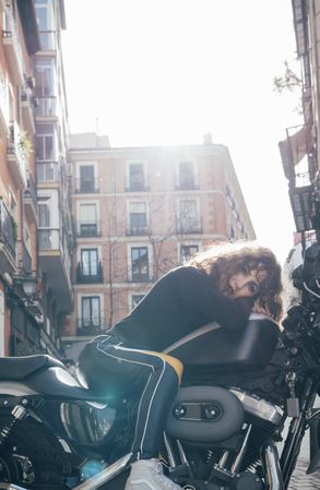Young woman in custom motorbike