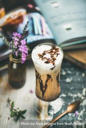 Latte in tall glass with chocolate syrup 4jgorb