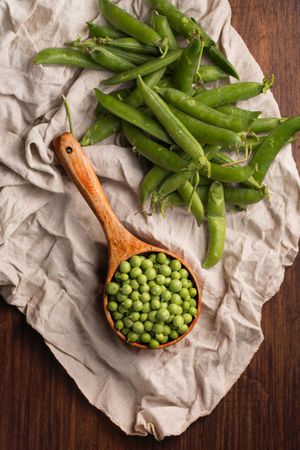 Peas in a wooden scoop