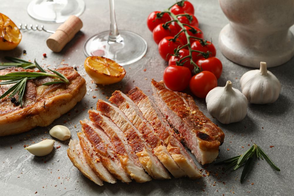 Composition with fried steaks and spices. Grilled food
