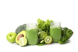 Green vegetables, fruits and jar of smoothie isolated on blank background