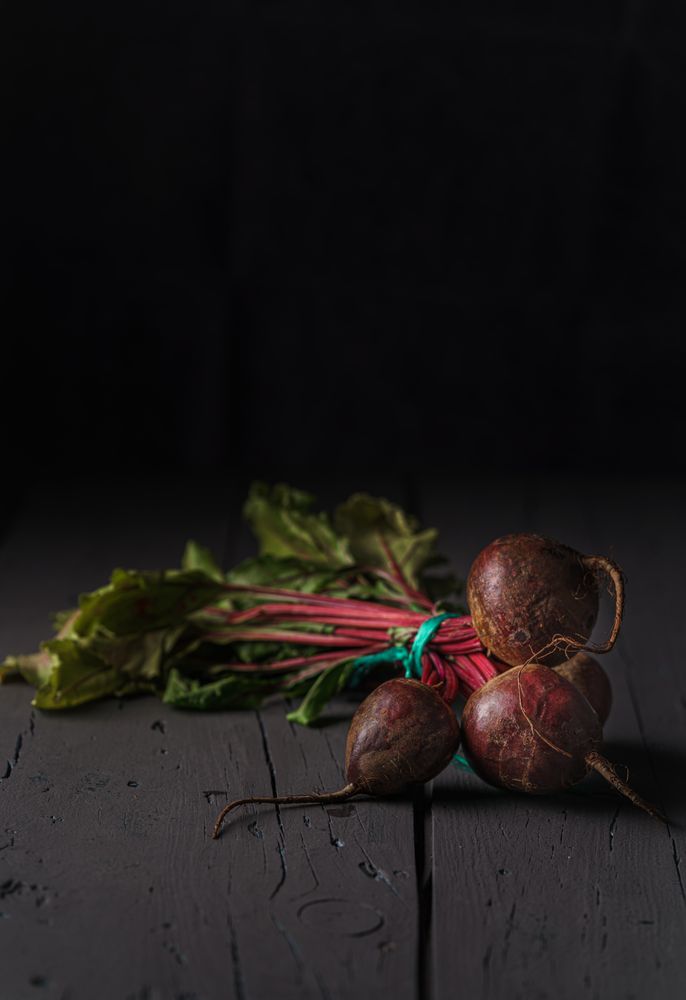 Bunch of raw beetroot with edible taproots and leaves