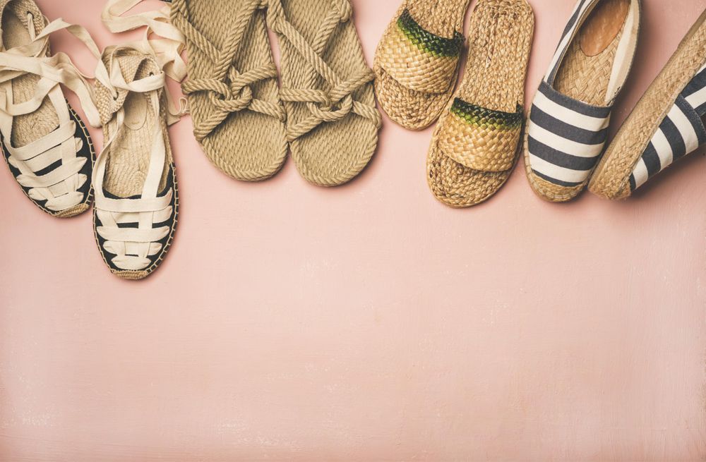 Variety of trendy summer shoes, with copy space