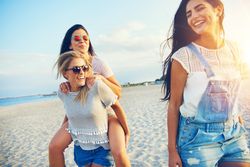 Three friends having fun on beach