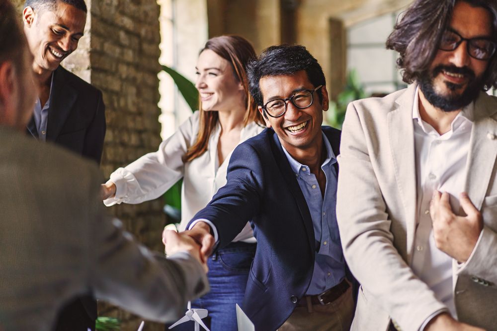 Multicultural business professionals celebrating success