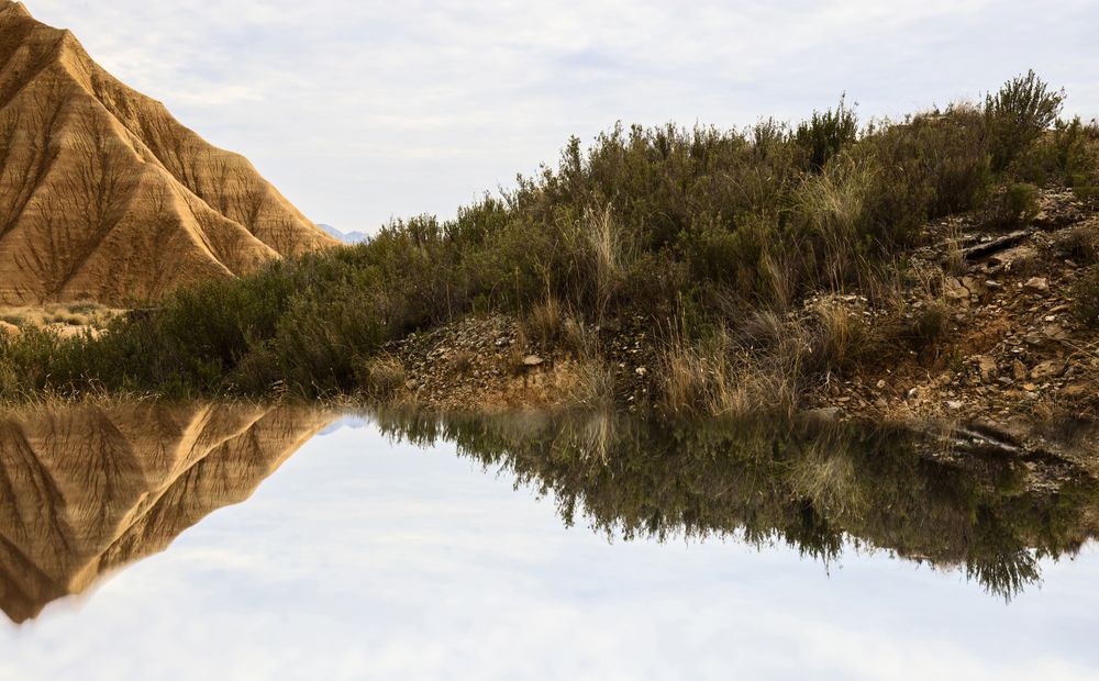 Water near stone desert hills