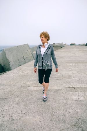 Mature sportswoman walking