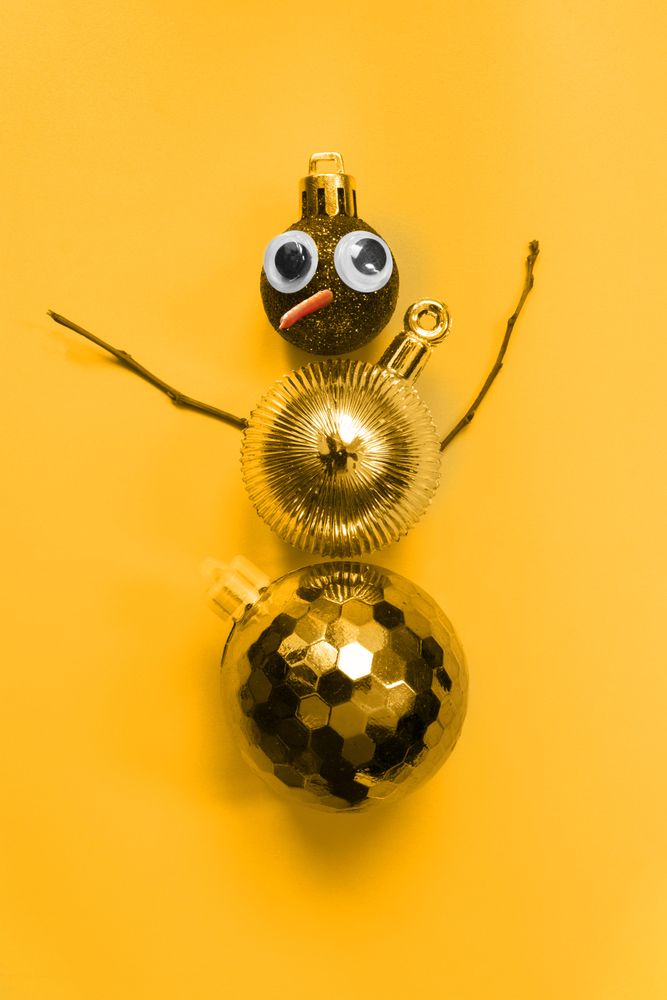 Gold snowman made out of Christmas decorations