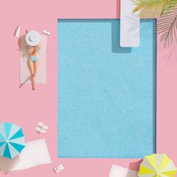 Barbie-like doll sunbathing poolside on towel with drink and sunglasses