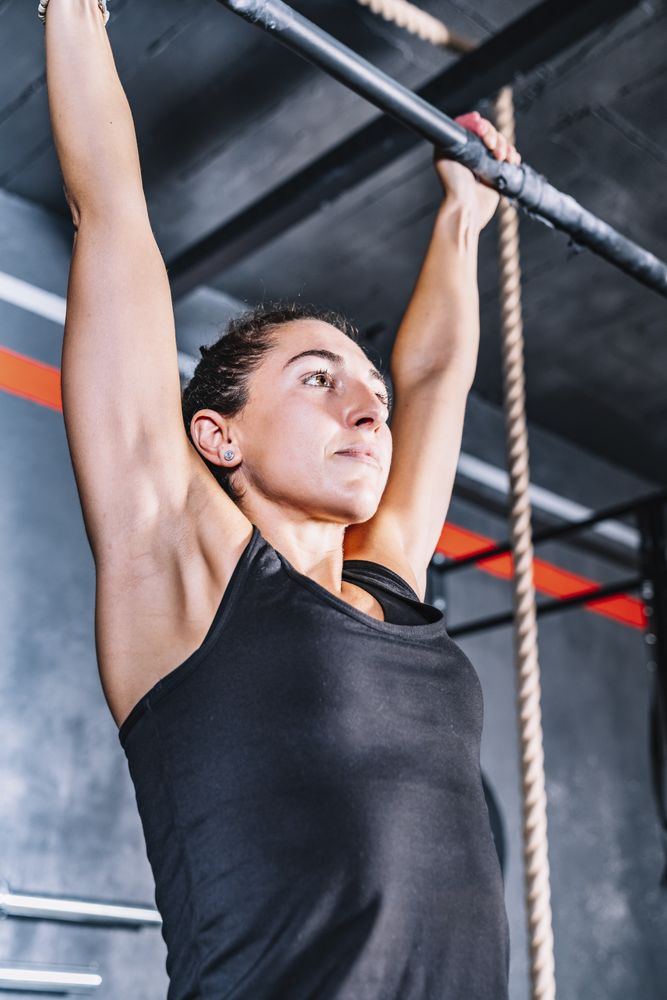 Hardworking female training in gym