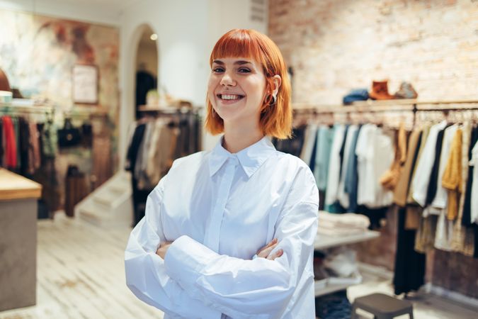 Trendy female boutique owner looking at camera and smiling