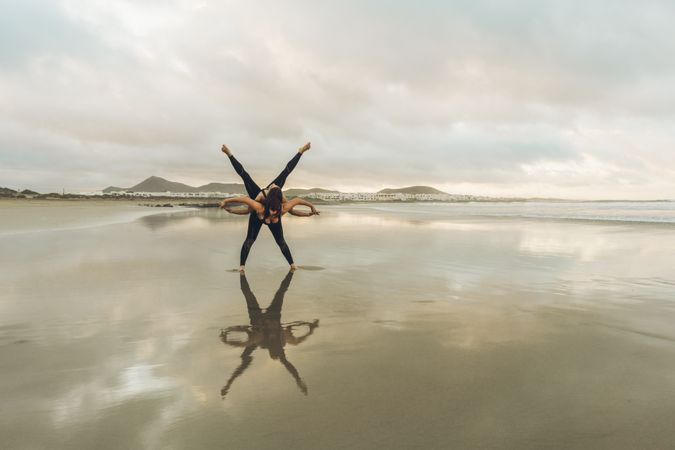 Women exercising near sea