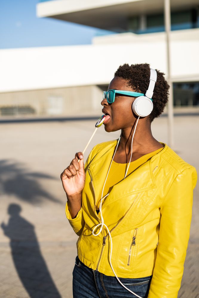 Black woman eating candy
