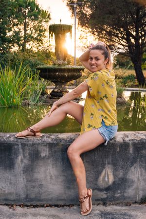 Joyful female posing in park