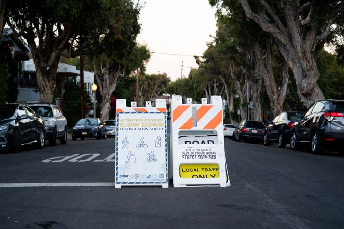 Signs discouraging car traffic supporting slow streets initiative