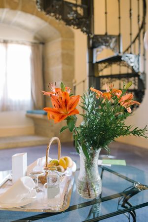 Bouquet and tray on table in hotel room