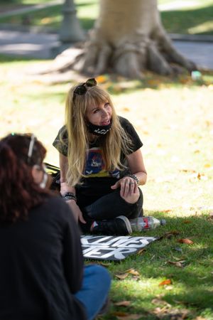 Los Angeles, CA, USA — June 16th, 2020: woman leading small group breakout at rally