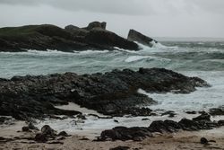 Small island near coast of Scotland on stormy day