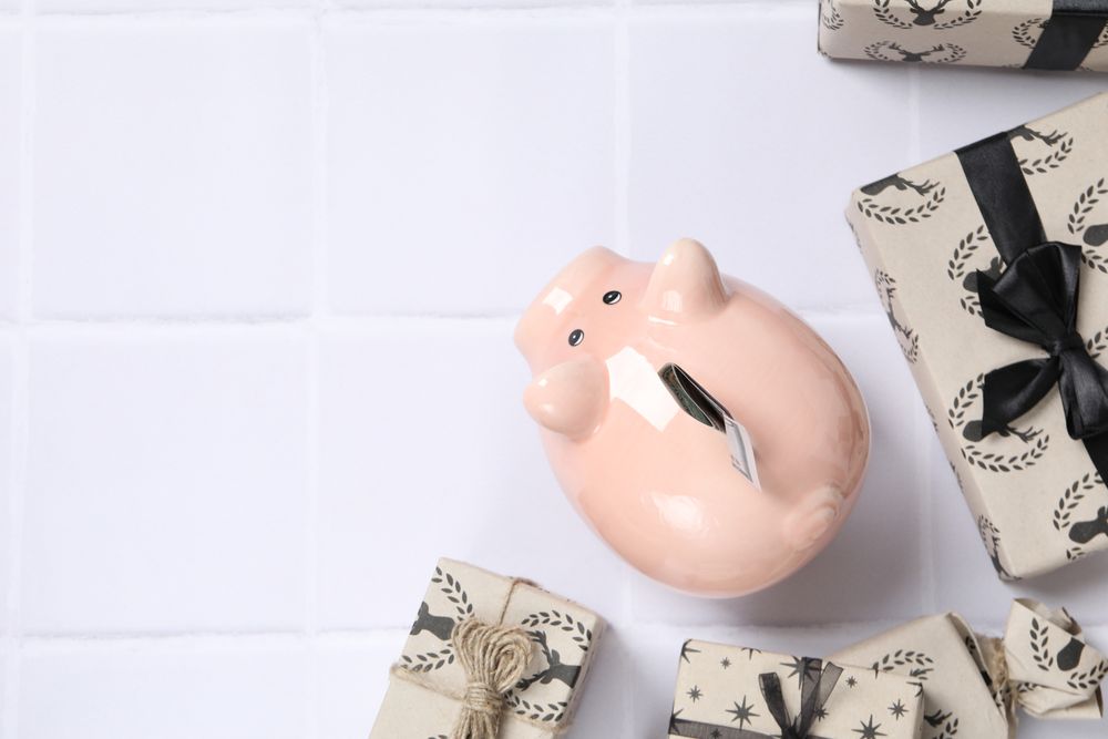 Concept of Christmas finance with piggy bank, space for text