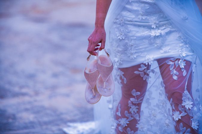 Bride Holding Shoes