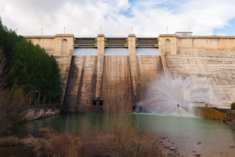 Concrete hydroelectric power station in sunlight