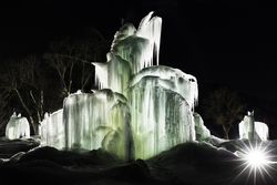 Lit up icicle structures at a snowy winter park